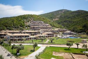 an aerial view of a resort with a mountain at Thassos Grand Resort in Alyki