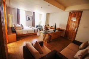 Postel nebo postele na pokoji v ubytování Liberta Hotel Jimbaran