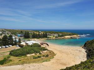 an aerial view of a beach near the ocean at NRMA Port Campbell Holiday Park in Port Campbell