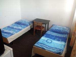 Postel nebo postele na pokoji v ubytování Sporthotel BK Pod Lipou