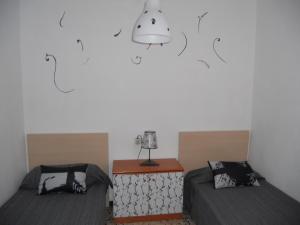 Кровать или кровати в номере Apartamento Carrer de l'Angel