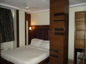 Postel nebo postele na pokoji v ubytování Hotel Sapna