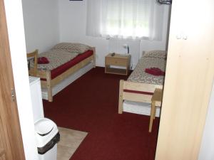 Postel nebo postele na pokoji v ubytování Penzion Kameňák