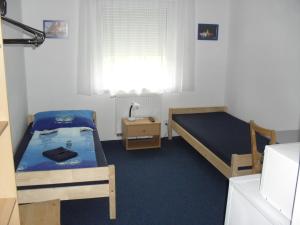 Postel nebo postele na pokoji v ubytování Penzion Kameňák