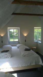 En eller flere senger på et rom på Moselundgaard B/B og Hestehotel