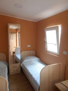 Postel nebo postele na pokoji v ubytování Guesthouse on Benashvili + 12 fotografií