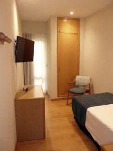 Postel nebo postele na pokoji v ubytování Hotel Tanit