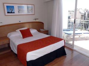 Postel nebo postele na pokoji v ubytování Hotel Tanit