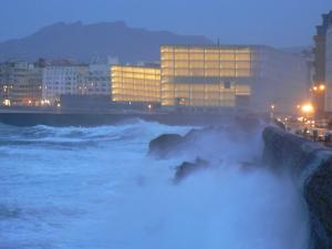 a bunch of waves in the ocean at night at Hotel Arrizul Beach in San Sebastián