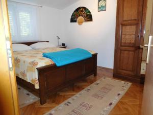 Postel nebo postele na pokoji v ubytování Apartments Ivancevic