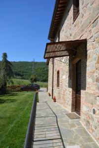 a brick building with a door on the side of it at Agriturismo La Provenca in Chianciano Terme
