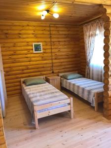 Un pat sau paturi într-o cameră la Guest House Semeyniy