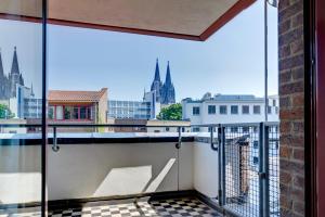 a balcony with a view of the city at Maternushaus in Cologne