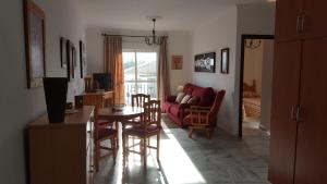 Posedenie v ubytovaní Apartamentos Saturnos