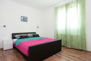 Posteľ alebo postele v izbe v ubytovaní Apartmani Jukic