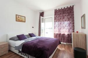 Posteľ alebo postele v izbe v ubytovaní Apartmani Jukic