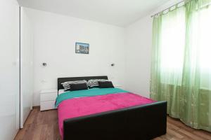 Posteľ alebo postele v izbe v ubytovaní Apartmani Jukic