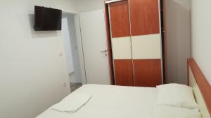 Postel nebo postele na pokoji v ubytování Apartments Vinko