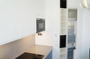 a kitchen with a counter and a refrigerator at T1 Moderne Plage des Catalans in Marseille