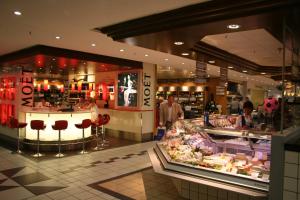 a shopping mall with a store with people in it at Apartment&Rooms near Brandenburg Gate in Berlin