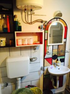 a bathroom with a toilet and a sink at Guesthouse 7even in Mostar