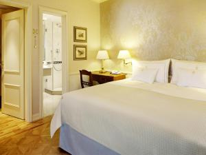 Postel nebo postele na pokoji v ubytování Colombi Hotel