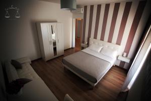 Postel nebo postele na pokoji v ubytování La Libra Rooms