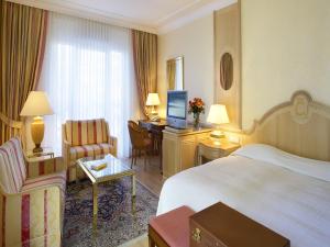 Postel nebo postele na pokoji v ubytování Colombi Hotel