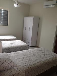 Ένα ή περισσότερα κρεβάτια σε δωμάτιο στο Hostel Araucaria