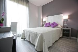 Posteľ alebo postele v izbe v ubytovaní Alix Boutique
