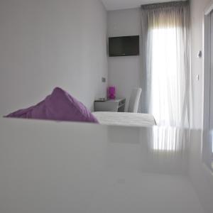 Posteľ alebo postele v izbe v ubytovaní Alix Boutique