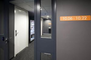 a sign on the side of a door in a hallway at easyHotel Amsterdam Zaandam in Zaandam