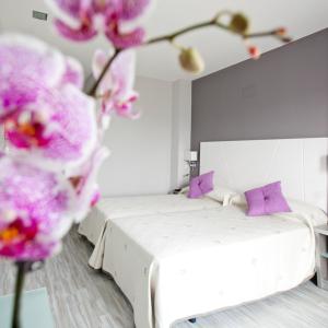 Posteľ alebo postele v izbe v ubytovaní Alix Boutique