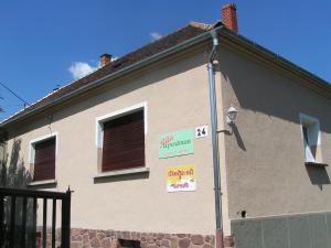 a house with signs on the side of it at Rita apartman in Szombathely