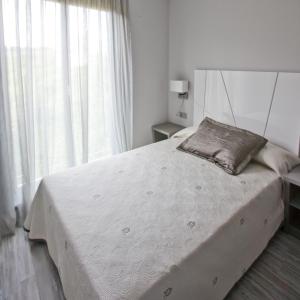Posteľ alebo postele v izbe v ubytovaní Alix Boutique