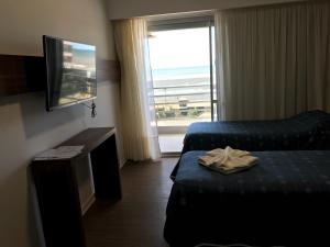 Tempat tidur dalam kamar di Hotel Luz y Fuerza San Bernardo - All Inclusive