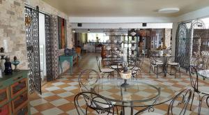 a dining room with a glass table and chairs at Levolle Marine in Poggio-Mezzana