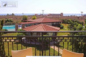 a view from the balcony of a house with a pool at Monachus Monachus in Frangokastello
