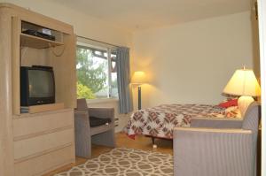 Vuode tai vuoteita majoituspaikassa Seaside Villa Motel & RV Park