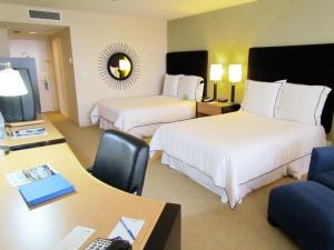 Кровать или кровати в номере Pacific Palms Resort and Golf Club