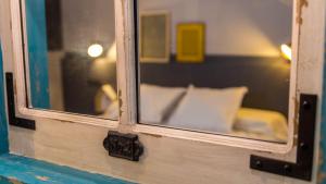Postel nebo postele na pokoji v ubytování Groc Rooms