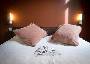 Voodi või voodid majutusasutuse Hotel Marcel toas