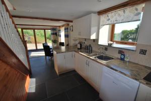 Kuchyň nebo kuchyňský kout v ubytování Lakeview Cottage + 10 fotografií