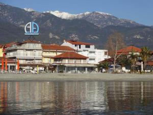 a hotel on the shore of a body of water at Anastasia Apartments in Leptokarya