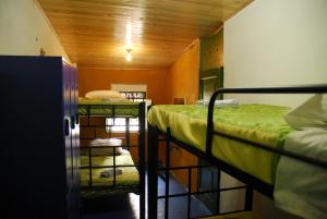 Postel nebo postele na pokoji v ubytování Hostal Gastro Bar Casa Colibrí + 37 fotografií
