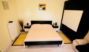 a bedroom with a large bed in a room at Apartman Darja in Umag