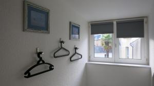 a bathroom with two mirrors on the wall next to a window at Katy's Home Dinard in Dinard