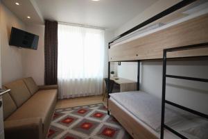 Postel nebo postele na pokoji v ubytování Sarajevo Daily Apartments