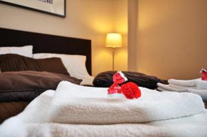 Posteľ alebo postele v izbe v ubytovaní Tartaczna Deluxe Apartments Gdansk