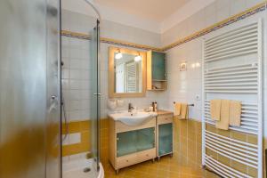 a bathroom with a sink and a shower at Apartments Mia in Malinska +63 photos